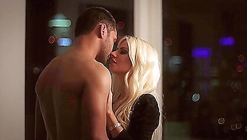 Blonde amateur milf in a black dress and stockings