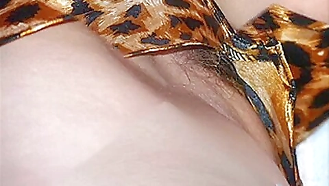 Mature hairy girl shows off her sexy curves on a sofa