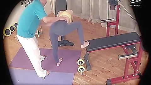 Sexy asian teen gets into a gym and gets peeped on